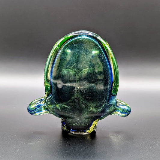 AKM Skull, 2015 Illuminati Sleeved Borosilicate Glass Pendant with Opal Eyes Approx. 2.4 x 2.4 in Hand blown glass made by AKM. Signed "AKM" + Dated "2015"