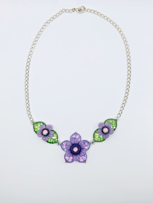 Mars Sparkly Purple and Green Floral Linked Choker Chain, 2024 Borosilicate Glass Necklace With Silver Plated Chain Approx. 37 mm x 20 mm Hand blown borosilicate glass choker necklace featuring opal centers made by Mars.