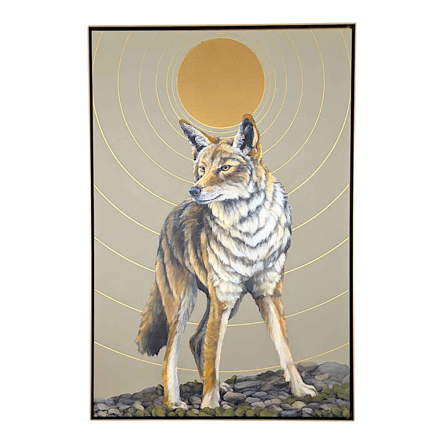 A framed art print depicting a coyote standing on rocks, with a large gold sun and concentric gold rings in the background, shown against a white backdrop.