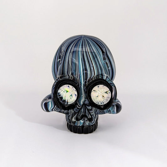 AKM x Akio Skull, 2018 Borosilicate Glass Pendant with Milles Over Opals For Eyes Approx. 2.4 x 2.4 in  Hand blown glass made by AKM and Akio. Signed "AKM" + Dated "2018"