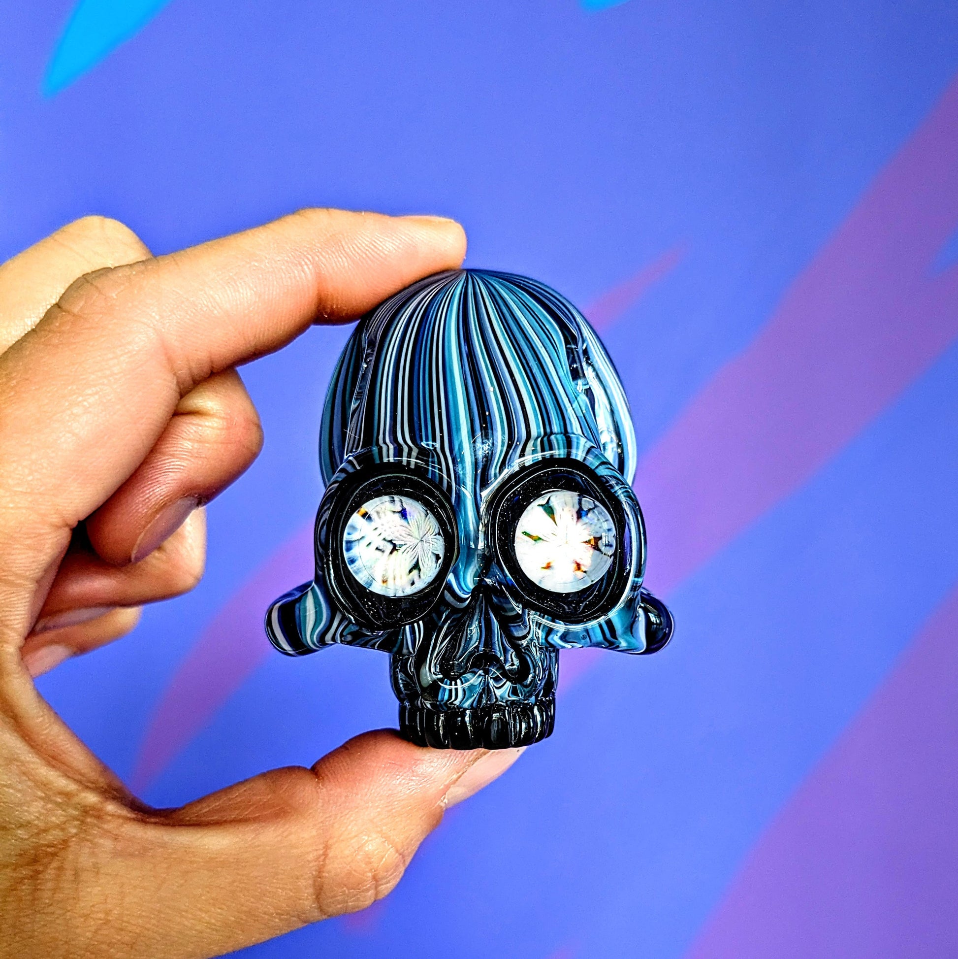AKM  Skull, 2018 Illuminati Sleeved Borosilicate Glass Skull Pendant with Opal Eyes Approx. 2.4 x 2.4 in Hand blown glass made by AKM. Signed "AKM" + Dated "2018"