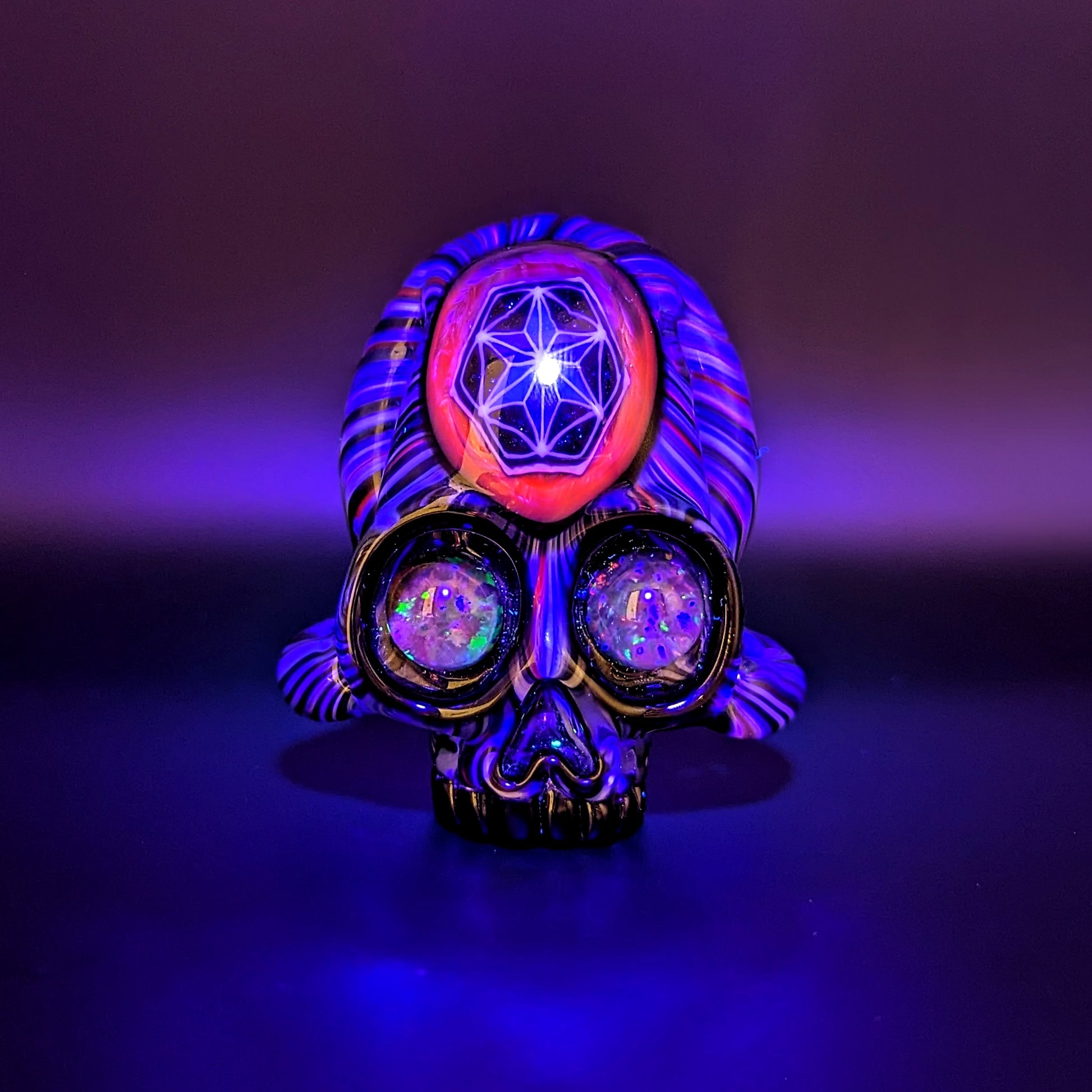 AKM x Akio Skull, 2018 Borosilicate Glass Pendant with Opal Eyes Approx. 2.4 x 2.4 in  Hand blown glass made by AKM and Akio. Signed "AKM" + Dated "2018"
