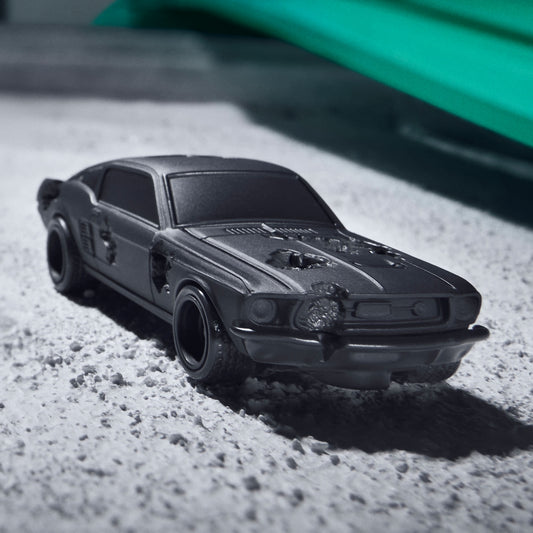 Daniel Arsham x Hot Wheels Ford Mustang, 2024  Features: Crystallized erosions Body Color: Arsham Black Body Type: Silkstone Chassis: ZAMAC Wheels: Real Riders 5-spoke mag wheels  Scale 1:64 Includes sealing label and Certificate of Authenticity Packaged in a collector display case 