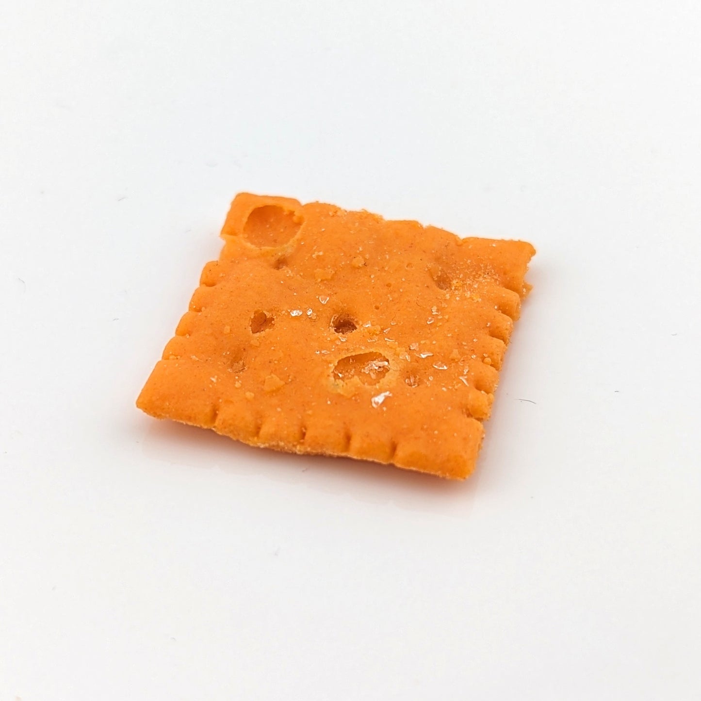 Eriko Kobayashi Cheez-It, 2024 Glass Sculpture Approx. 27 x 29 x 4 mm  From Eriko Kobayashi's Hyper-Realistic Glass Food Series