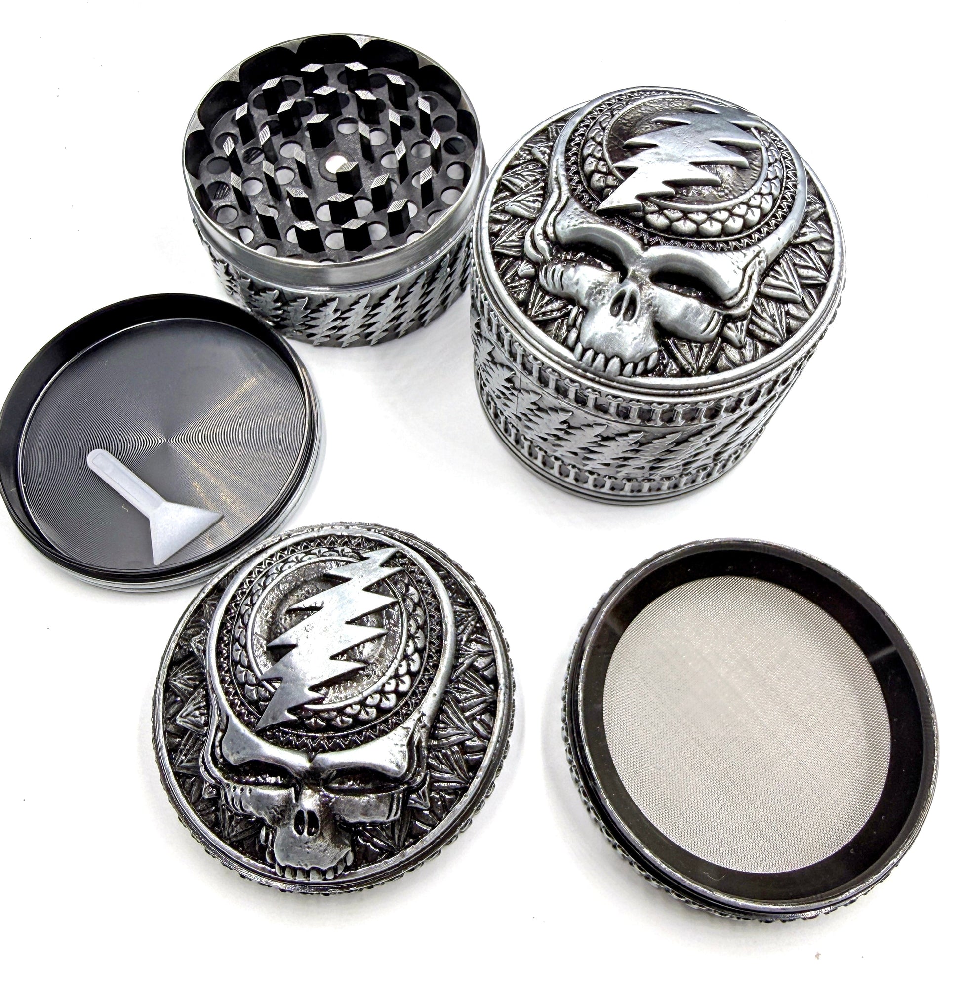 The Grateful Grinder. Designed by Zoltron. The best Grinder in the known universe. Limited Edition of 600 Extreme Quality, 4-piece aluminum Grinder 2.5" Tall X 2.5" Wide Sculpted Aluminum cast. Laser etched bottom About the Anodized Finish: You can expect some subtle variation in the anodized finish. Anodizing is a food safe surface conversion finish, where the color becomes part of the aluminum rather than sitting on top like paint. Subtle variations in tone and how fine details appear are a natural part o
