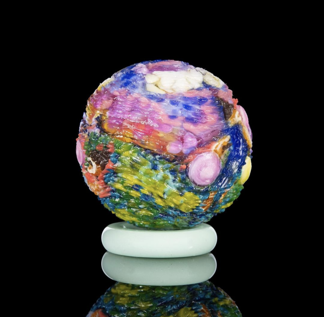 Hallie Krebs Never Miss A Sunday Show, 2023 Borosilicate Glass Marble Approx. 40 mm  Hand blown & carved borosilicate glass marble made by Hallie Krebs.