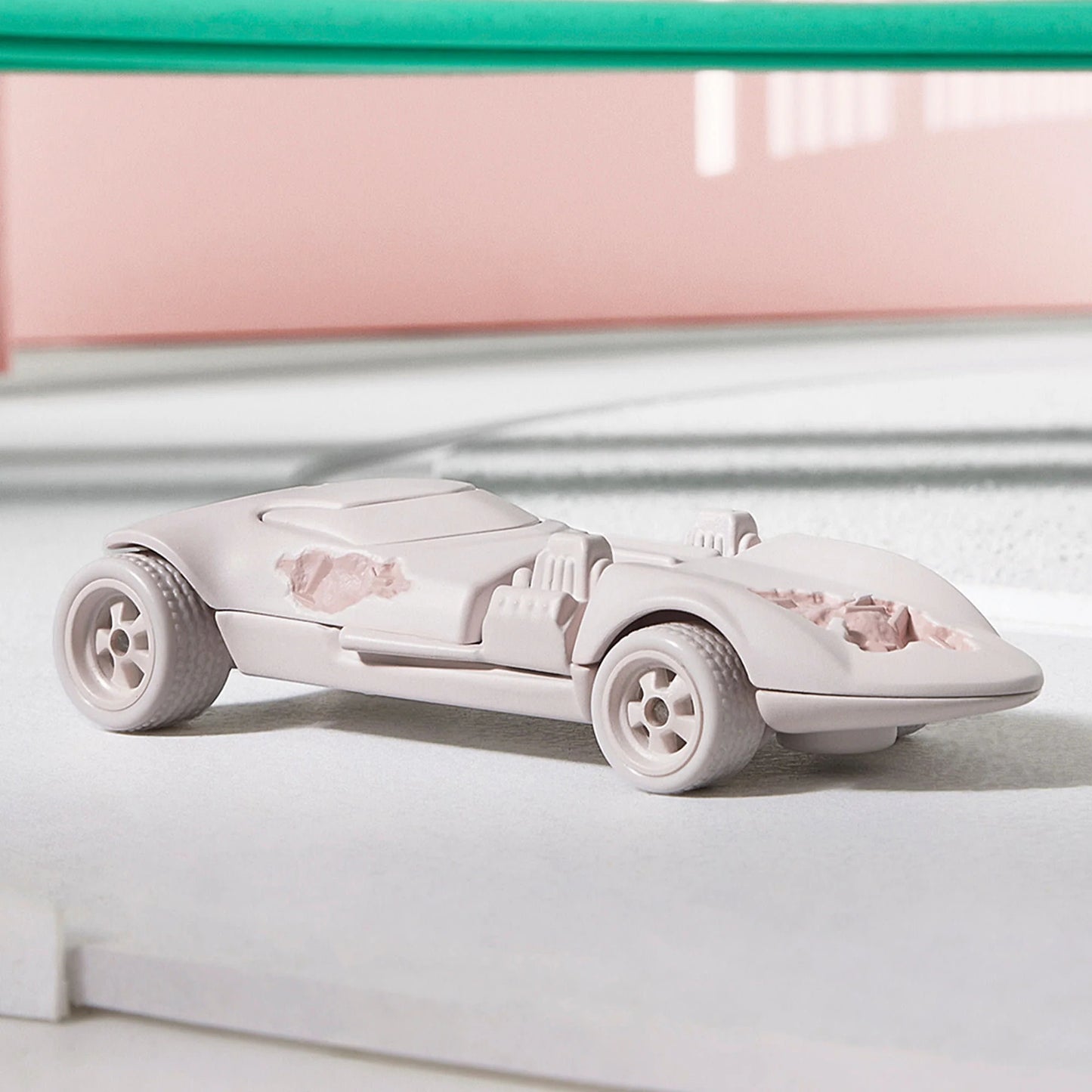 Daniel Arsham x Hot Wheels  Eroded Twin Mill, 2024 Features: Crystallized erosions Body Color: Arsham Pink Body Type: Silkstone Chassis: ZAMAC Wheels: Arsham pink Real Riders 5-spoke classic wheels Scale 1:64 Includes sealing label and Certificate of Authenticity Packaged in a collector display case with simulated concrete base.