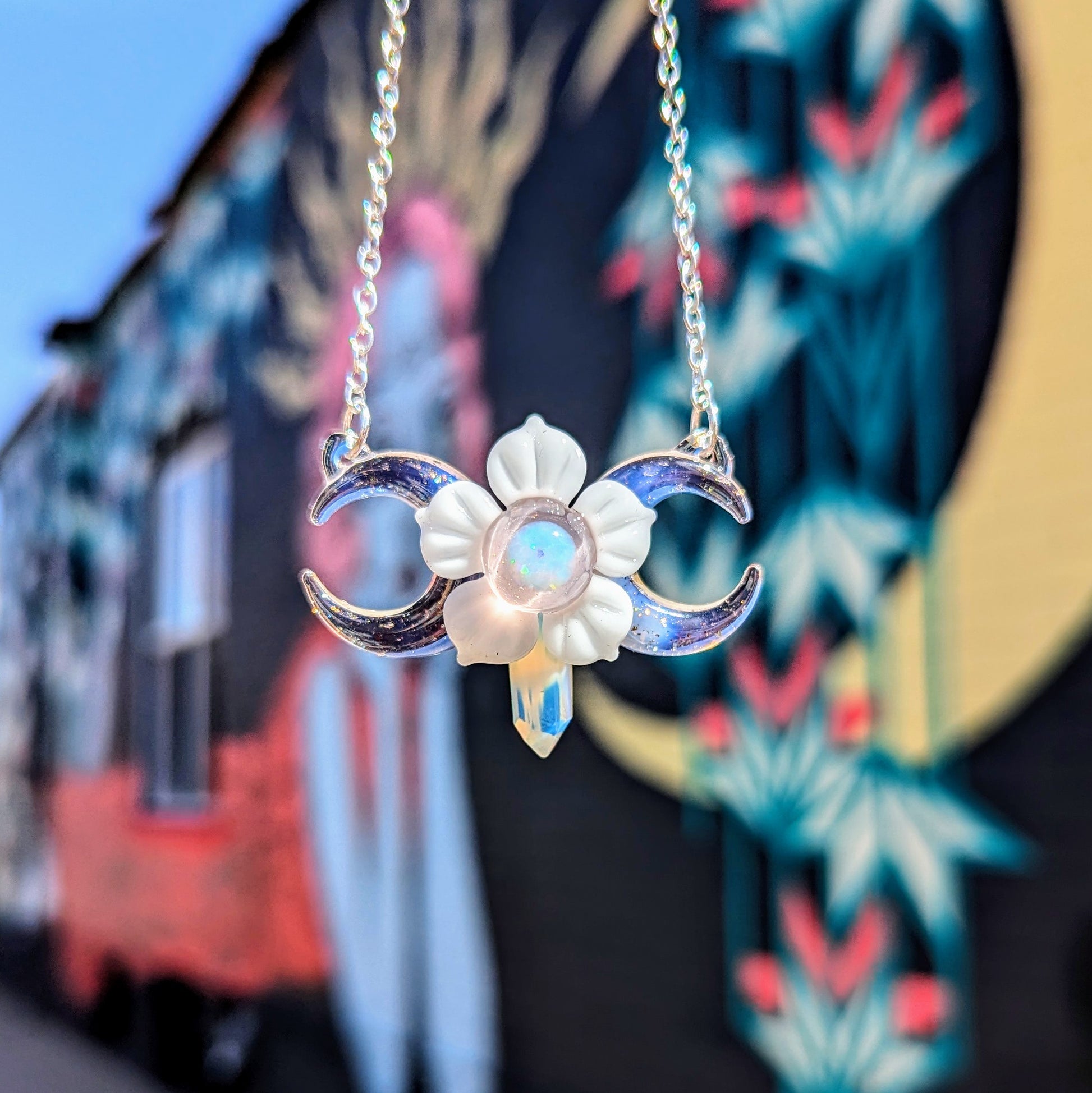 Mars Pink Triple Moon With Flower & Crystal Point, 2024 Borosilicate Glass Pendant Approx. 48 mm x 35.5 mm Hand blown & cold worked borosilicate glass pendant made by Mars.