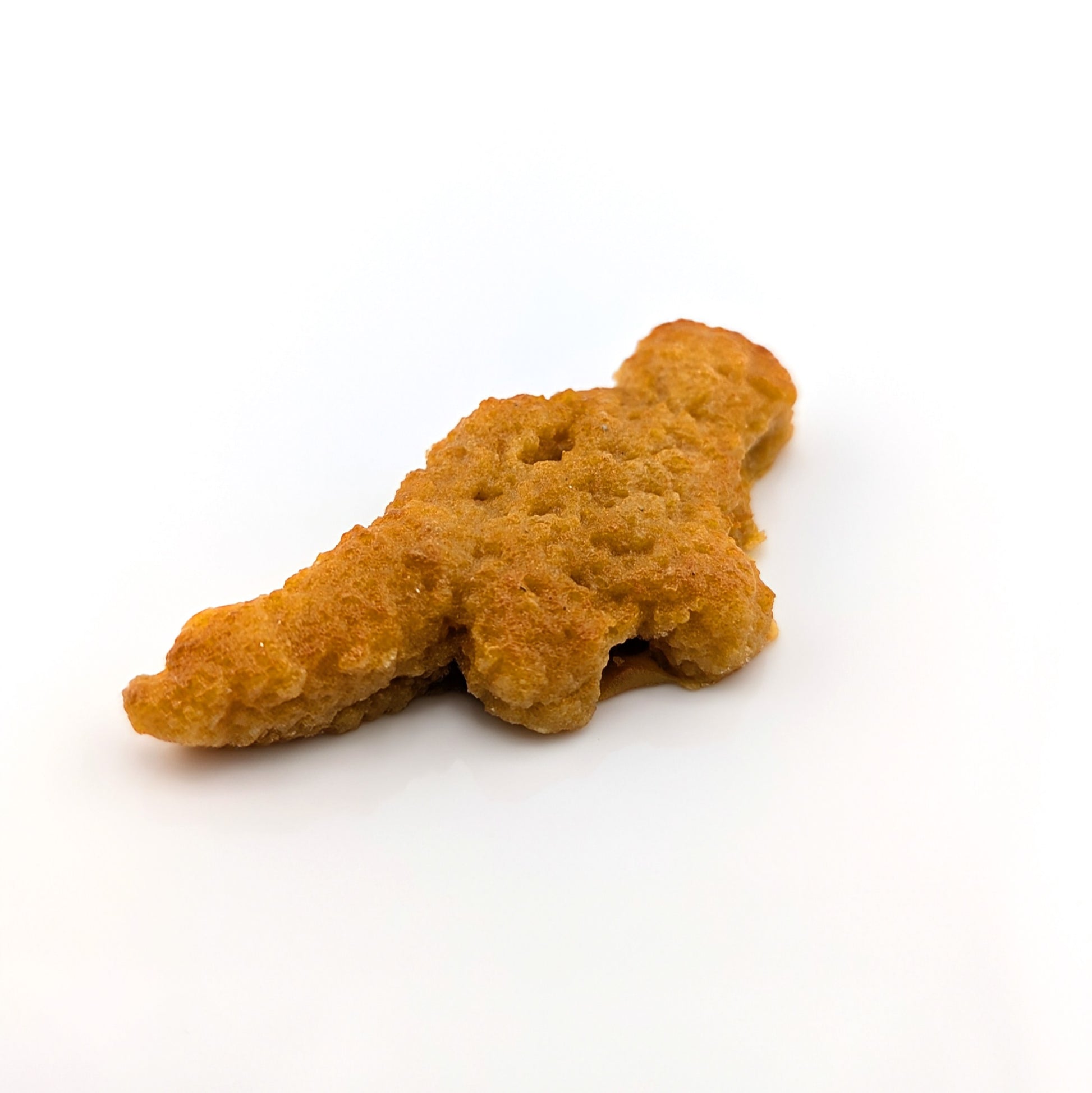 Eriko Kobayashi
Dino Nugget, 2024
Glass Sculpture
Approx 66.5 x 30.5 x 11 mm

From Eriko Kobayashi's Hyper-Realistic Glass Food Series