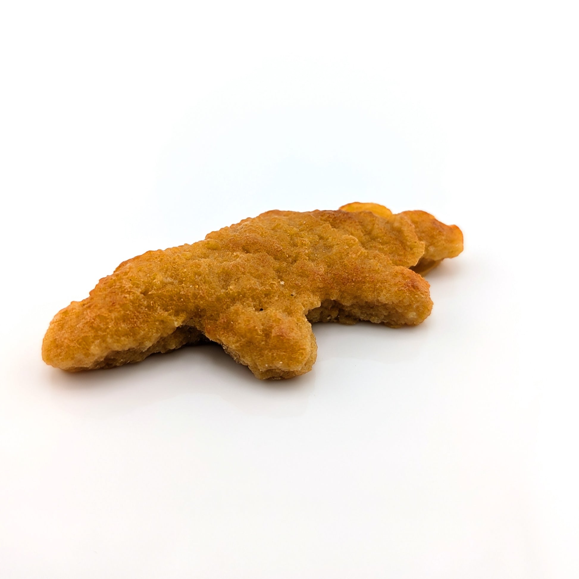 Eriko Kobayashi
Dino Nugget, 2024
Glass Sculpture
Approx 68.5 x 30 x 11 mm

From Eriko Kobayashi's Hyper-Realistic Glass Food Series