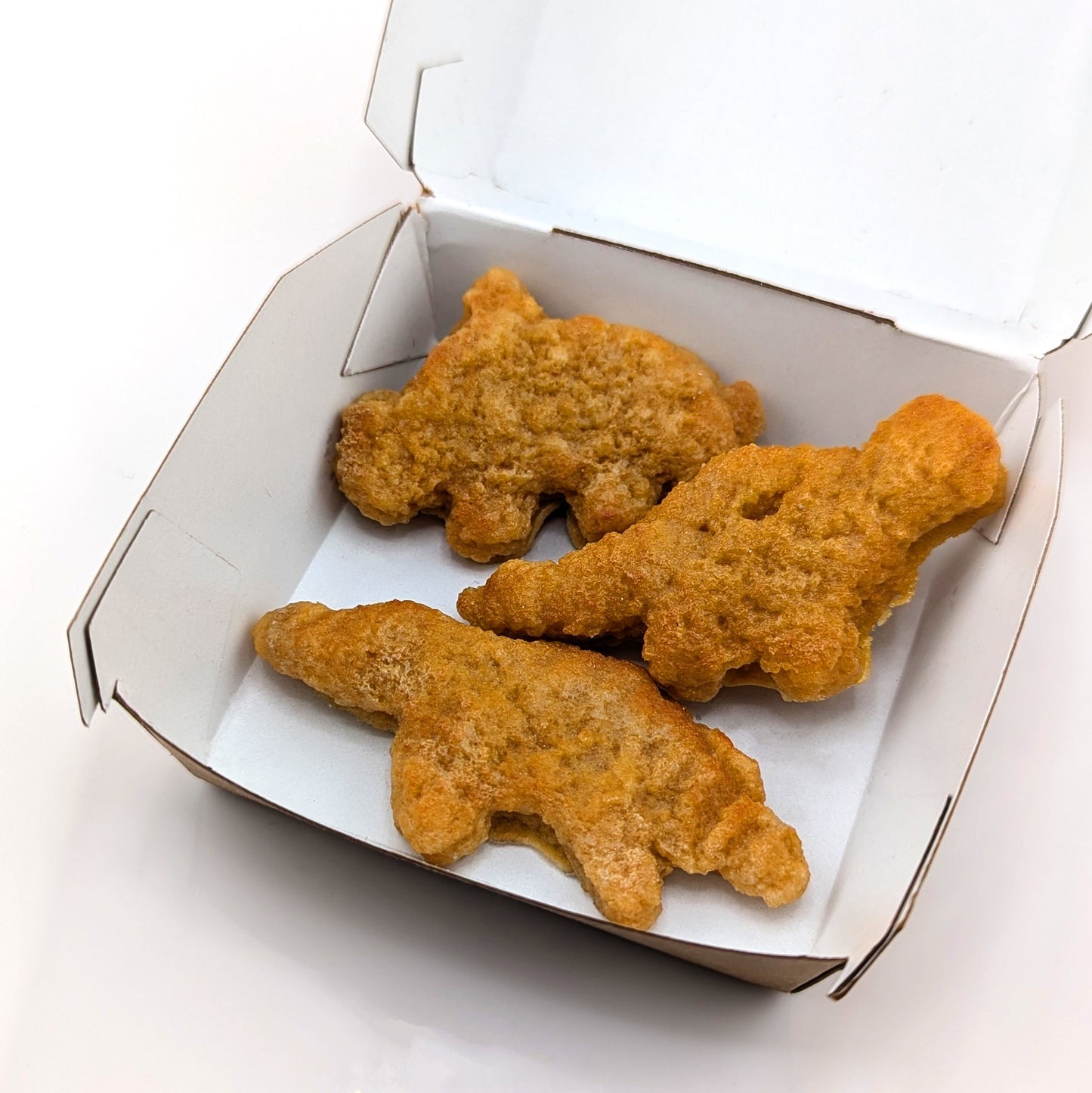 Eriko Kobayashi
Dino Nugget, 2024
Glass Sculpture Set
Dimensions Vary (Approx 70 x 30 x 10 mm, 59 x 37 x 10 mm, 66 x 30 x 11 mm)

From Eriko Kobayashi's Hyper-Realistic Glass Food Series. Meal Deal (set) includes 3 individual glass dino nugget sculptures.