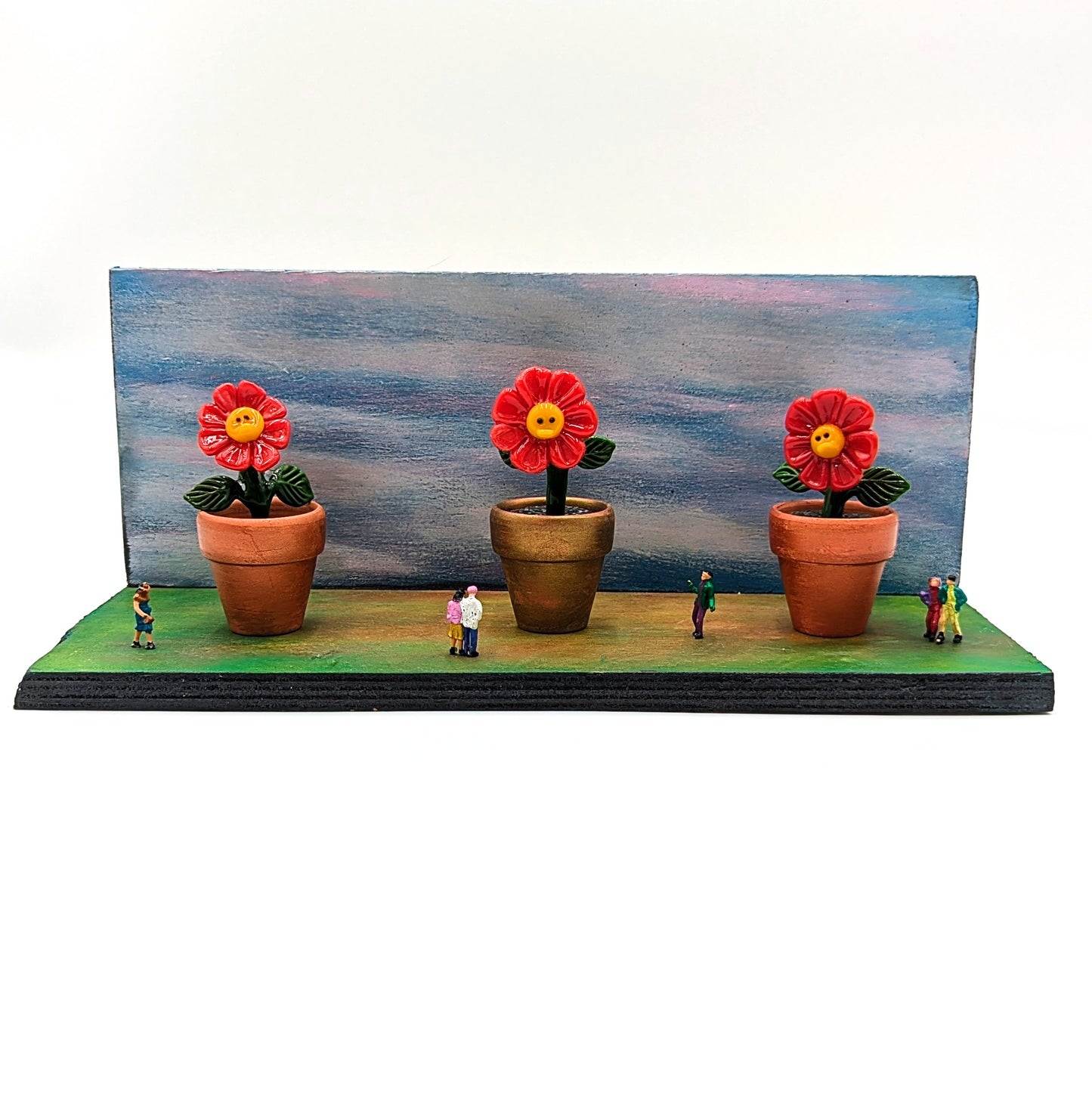 Ethan Windy
Land of the Giants, 2024
Glass Sculpture
Potted flower (each): 41 mm diameter | 86 mm tall
Hand painted wood base: 12 x 5 in

Signed + Dated by the artist. Ethan Windy's Giant Flowers Series