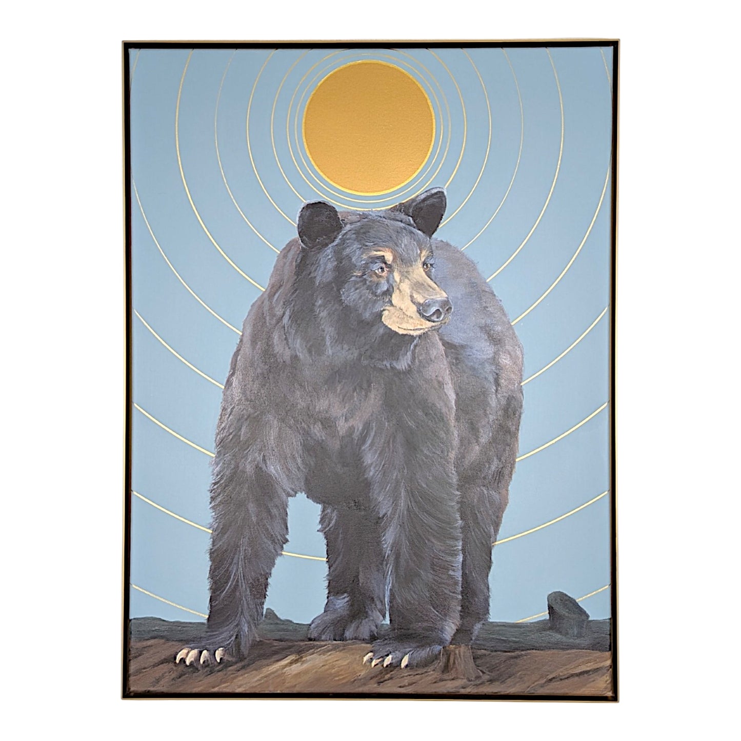 A framed art print depicting a large black bear standing on a rocky ground against a light blue sky with a large yellow sun and concentric yellow rings.