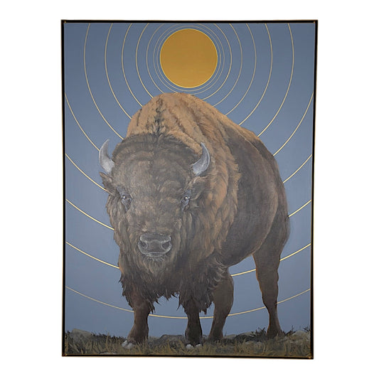 A framed art print depicting a large brown bison standing against a muted blue-gray sky with concentric gold rings and a gold sun, shown on a white background.
