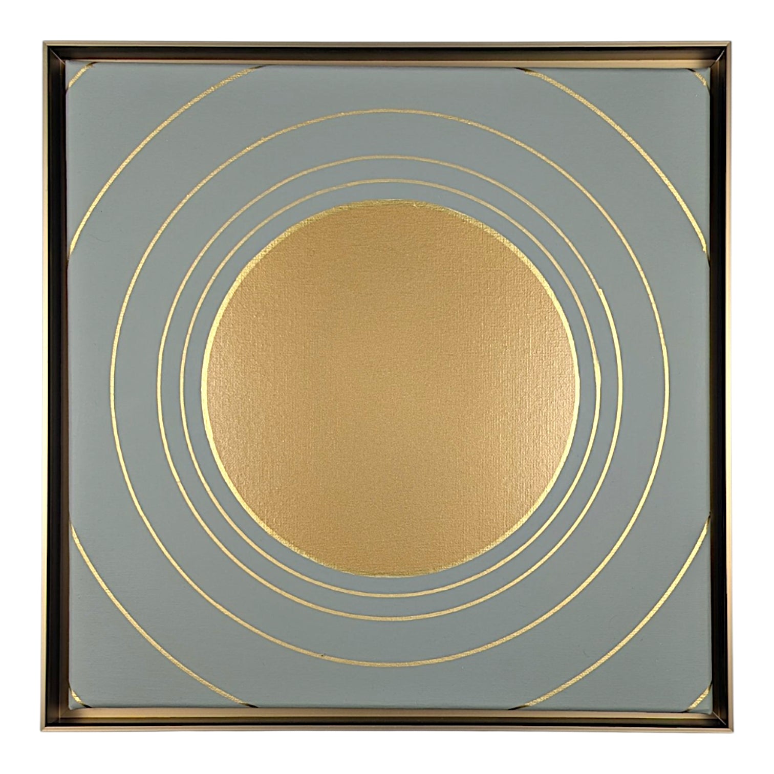Square abstract wall art featuring a textured metallic gold circle centered within a square field of muted blue-gray, accented by thin gold concentric rings and a thin dark metallic border.