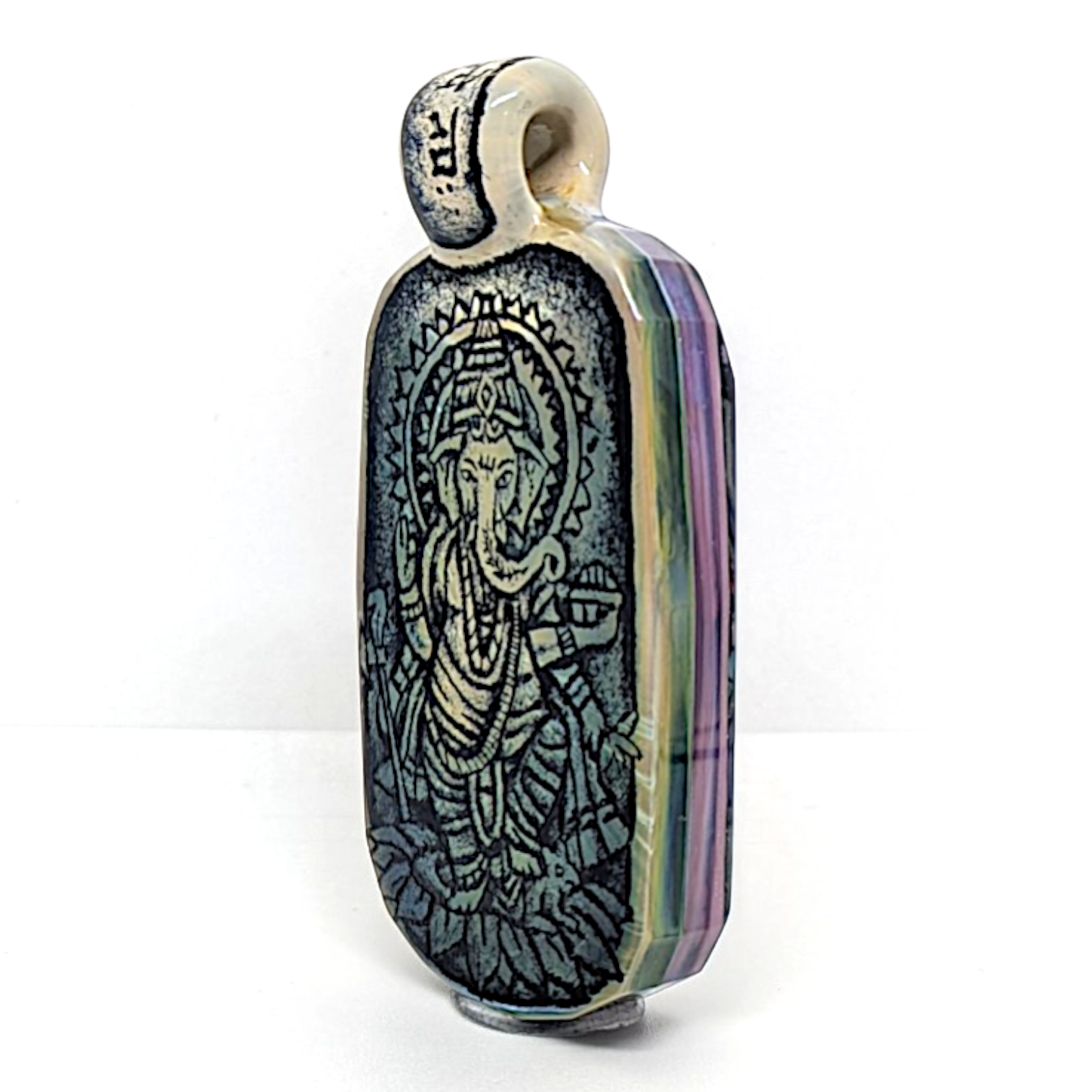 Trevy Metal x WJC
Ganesha Tablet, 2026
Borosilicate glass pendant
69 x 34 mm

*Please note this piece is featured in Trevy Metal’s solo show that will be on display until May 23rd, 2026. Artwork from the exhibition will be shipped early the following week. Thank you for your support & understanding :)