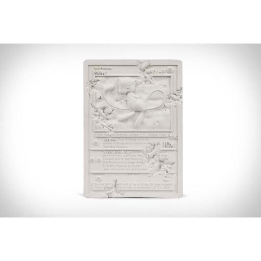 Daniel Arsham x Pokemon Crystalized Mew Card, 2022 12 x 8.6 x 1 in / 5 lbs Edition of 500  WHITE CRYSTALIZED MEW CARD is a sculpture modeled after the 1st edition Mew Card in the Pokémon Trading Card Game. It has been reimagined as a monument of Kanto uncovered through the passage of time. This edition, made of white cast resin and crystal dust, is a scaled down version of larger work made in Arsham Studio.
