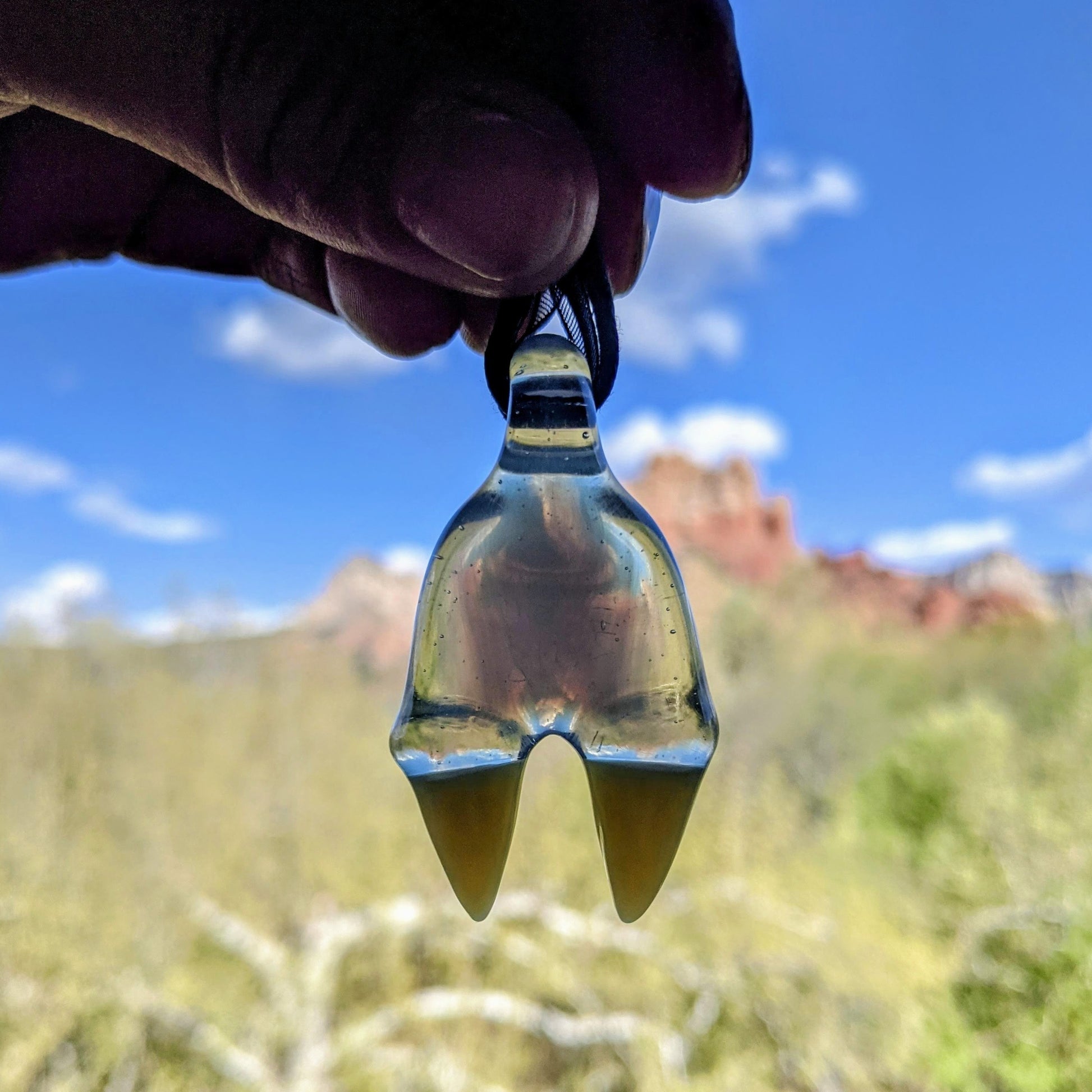 Elbo Dino Head, 2023 Pastel Potion Borosilicate Glass Pendant Approx. 2 x 1.1 in  Hand blown glass made by Elbo (Matt Selbovitz). Signed "Elbo" + Dated⁠ "2018"