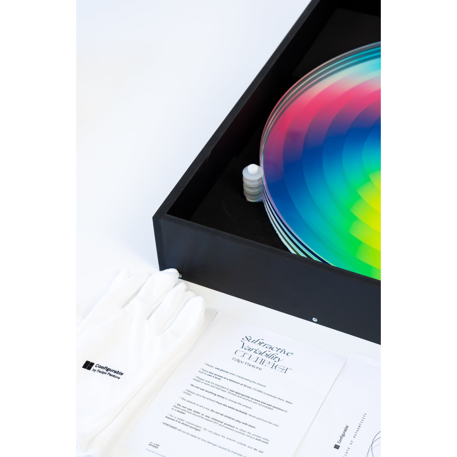 Felipe Pantone Subtractive Variability Compact, 2022 UV paint, PMMA, pulleys 18.5 x 18 x 2 in / 9.921 lb Edition of 200  Hand Signed & Numbered by the artist  Accompanied by Certificate of Authenticity, original artist packaging and gloves. Edition entirely created and produced at Felipe Pantone's Studio in Valencia, Spain.