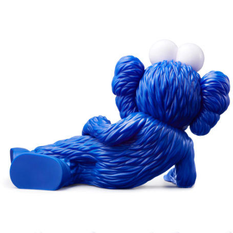 KAWS Time Off (Blue), 2023 Vinyl figure 7.1 x 11 x 5.9 in  KAWS is continuing his new standing tradition of Valentine's Day drops, with the release of his TIME OFF Vinyl Figures. The TIME OFF vinyl figure is lying down on his right side, with his legs crossed, and right hand supporting its head. The pink BFF figure has pink "X" marked eyes and "X" marked hands and feet, identical to KAWS’ Companion character. Each figure measures 7.1 x 11 x 5.9" and comes with a protective KAWS branded box.