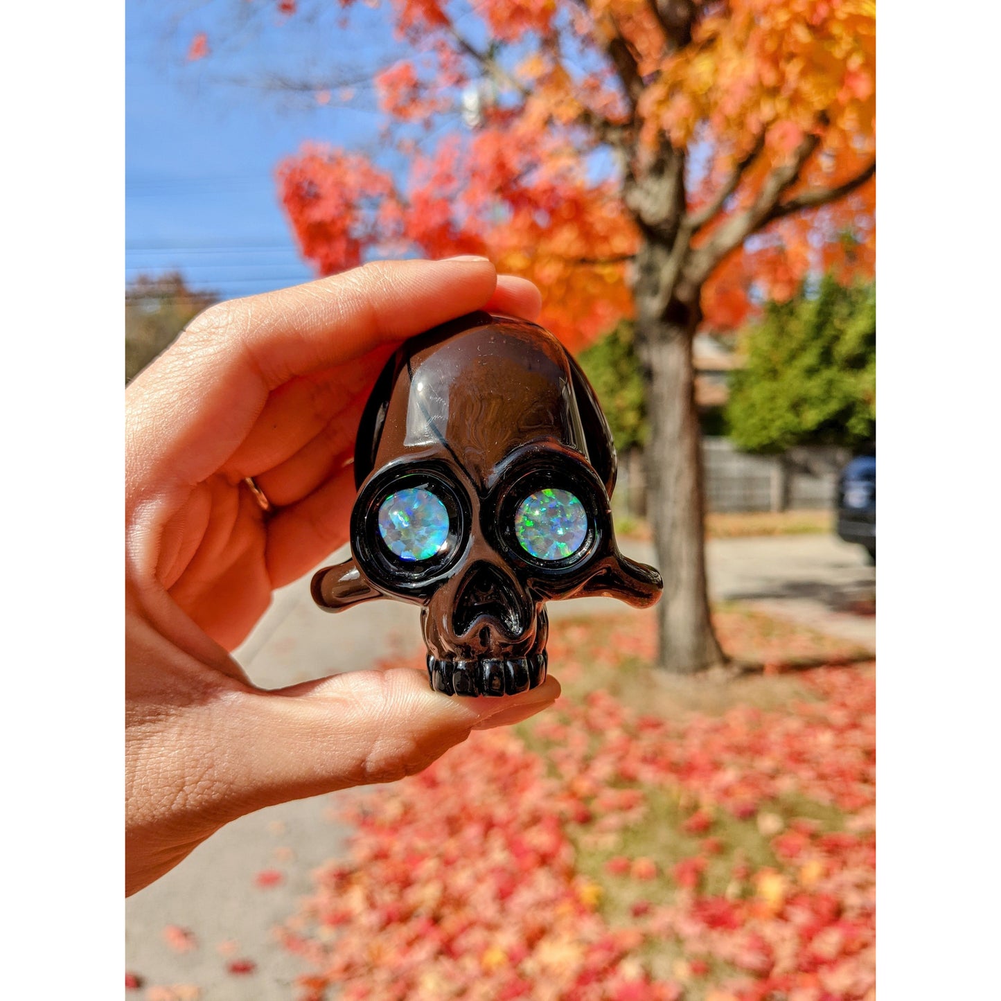 AKM  Skull, 2017 Northstar 144 Grizzly Brown Borosilicate Glass Skull Pendant with Opal Eyes Approx. 2.6 x 2.4 in  Hand blown glass made by AKM. Signed "AKM" + Dated "2017"